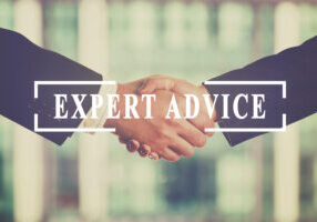 Businesspeople handshake. Expert advice, business, communication concept. Added retro filter.